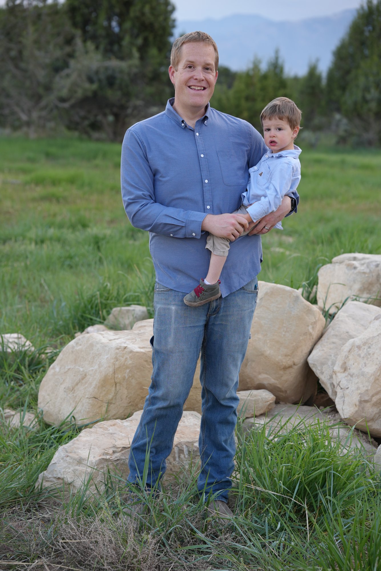 Tyler Rencher with his son on their property in Spring City, Utah